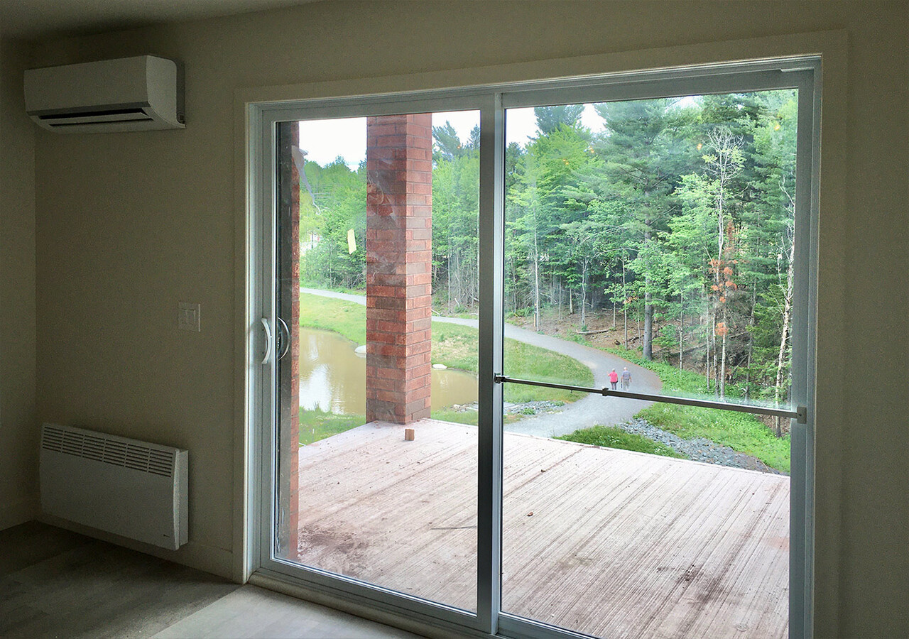 Dining room with the living room in background